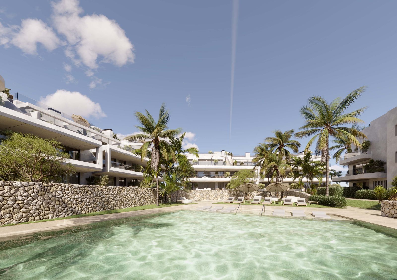 Luxe resort The Palms met zwembad en palmbomen.