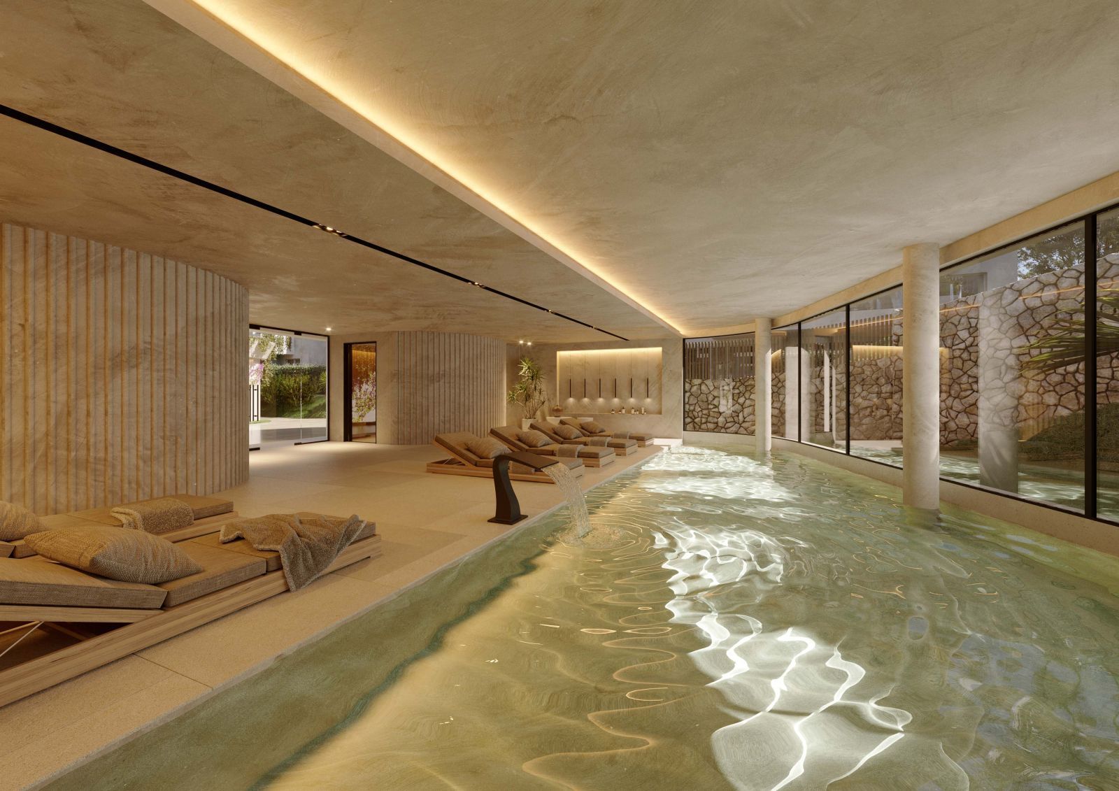 Binnenzwembad met ligstoelen in The Palms resort